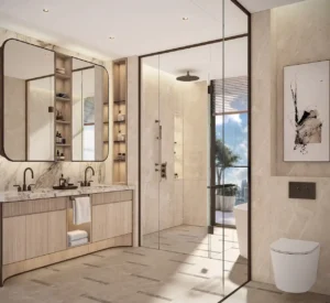 Penthouse master bathroom at Atelis at d3 featuring marble finishes, double vanity, walk-in rain shower, and floor-to-ceiling glazing with refined contemporary detailing in Dubai Design District. Presented by Tohid Fetrat.