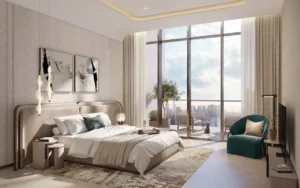 Penthouse master bedroom at Atelis at d3 featuring floor-to-ceiling windows, refined contemporary design, soft neutral finishes, and a private terrace with panoramic Dubai skyline views in Dubai Design District. Presented by Tohid Fetrat.