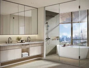 Master bathroom in a sky villa at Atelis at d3 featuring double vanity, walk-in rain shower, freestanding bathtub, premium finishes, and panoramic city views over Dubai Design District. Presented by Tohid Fetrat.