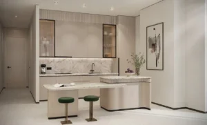 Open-plan sky villa kitchen at Atelis at d3 featuring a marble island, minimalist cabinetry, integrated appliances, and refined contemporary finishes in Dubai Design District. Presented by Tohid Fetrat.