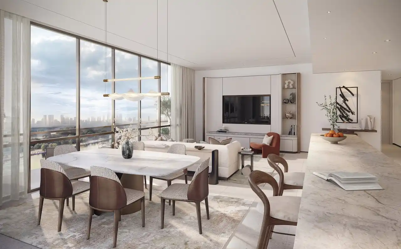Open-plan dining and living area in a typical residence at Atelis at d3, featuring floor-to-ceiling windows, refined modern interiors, natural light, and elegant finishes overlooking Dubai Design District. Presented by Tohid Fetrat.