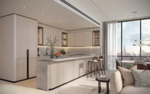 Open-plan kitchen in a typical residence at Atelis at d3, featuring a marble island, integrated cabinetry, modern finishes, and floor-to-ceiling windows with Dubai skyline views in Dubai Design District. Presented by Tohid Fetrat.