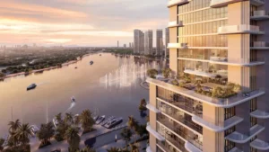 Waterfront residential tower at Atelis at d3 overlooking Dubai Creek, featuring contemporary glass façades, private terraces, marina views, and sunset skyline scenery in Dubai Design District. Presented by Tohid Fetrat.