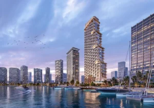 Waterfront residential towers of Atelis at d3 overlooking the marina, featuring contemporary architecture, yachts, and a vibrant urban skyline in Dubai Design District. Presented by Tohid Fetrat.