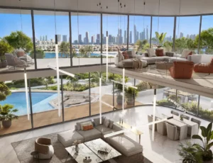 Double-height living and dining space at Bella at Passo by Beyond Beach Mansion featuring an upper lounge level, floor-to-ceiling glass, sculptural pendant lighting, private pool terrace, and panoramic Dubai skyline views on Palm Jumeirah, Presented by Tohid Fetrat