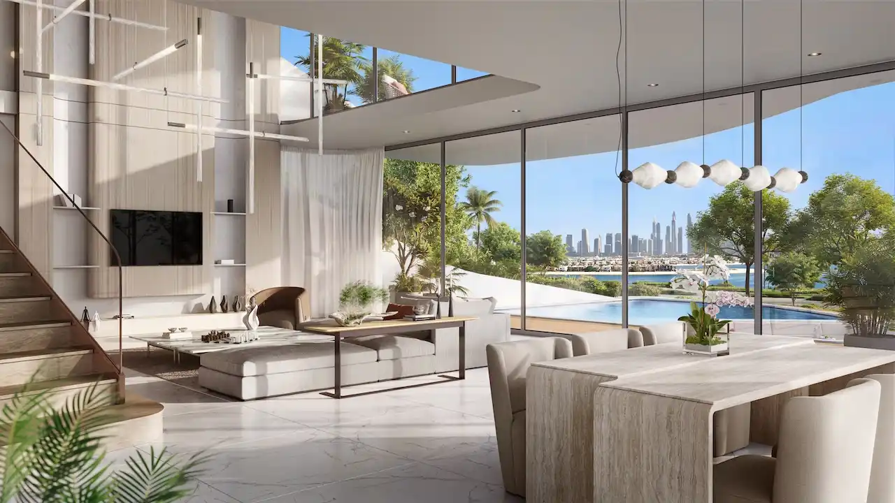 Double-height living and dining area at Bella at Passo by Beyond Beach Mansion featuring floor-to-ceiling glass, modern open-plan design, private pool outlook, and panoramic Dubai skyline views on Palm Jumeirah, Presented by Tohid Fetrat