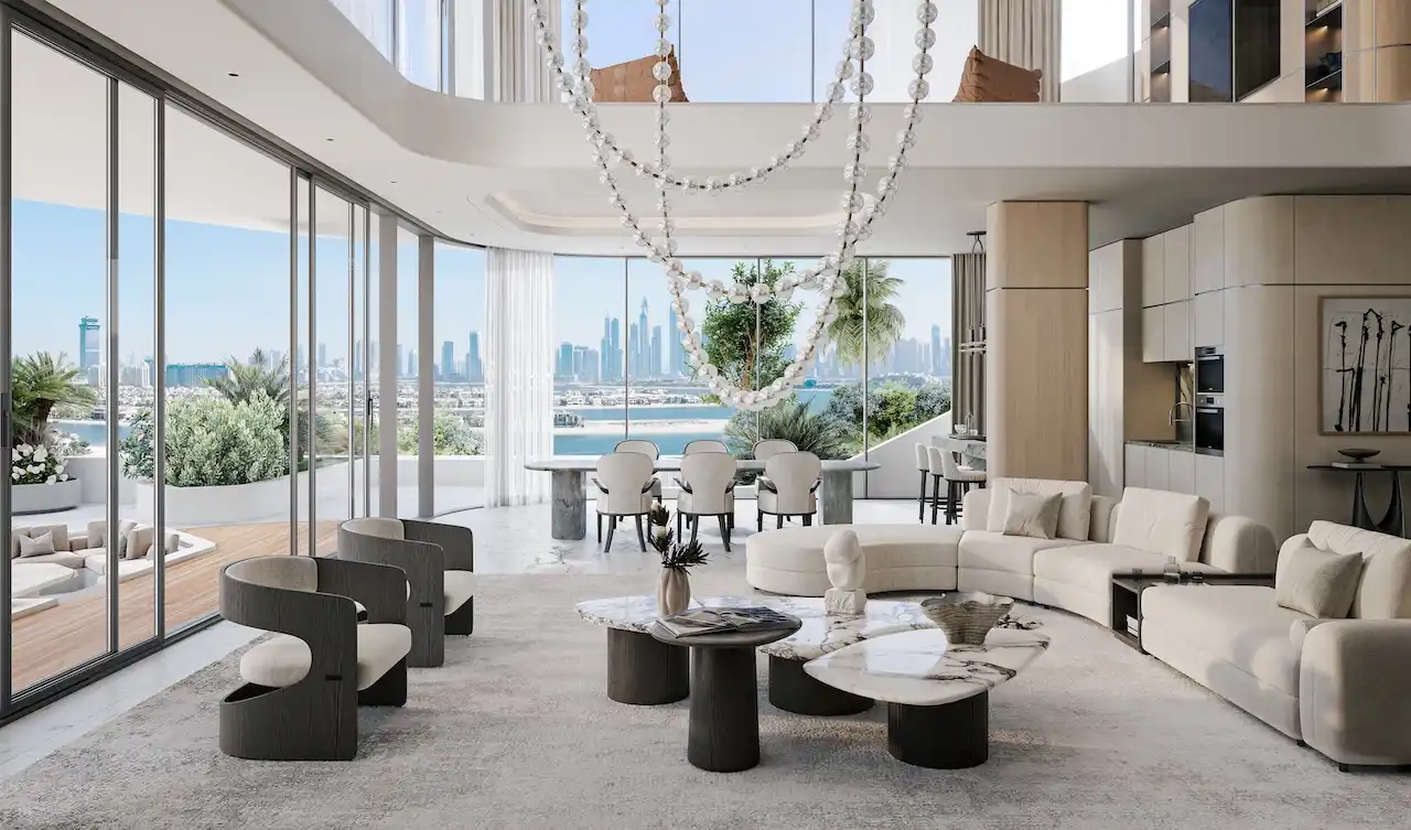 Double-height living and dining area at Bella at Passo by Beyond Beach Mansion with floor-to-ceiling windows, sculptural chandelier, open-plan luxury interiors, and panoramic Dubai skyline views on Palm Jumeirah, Presented by Tohid Fetrat