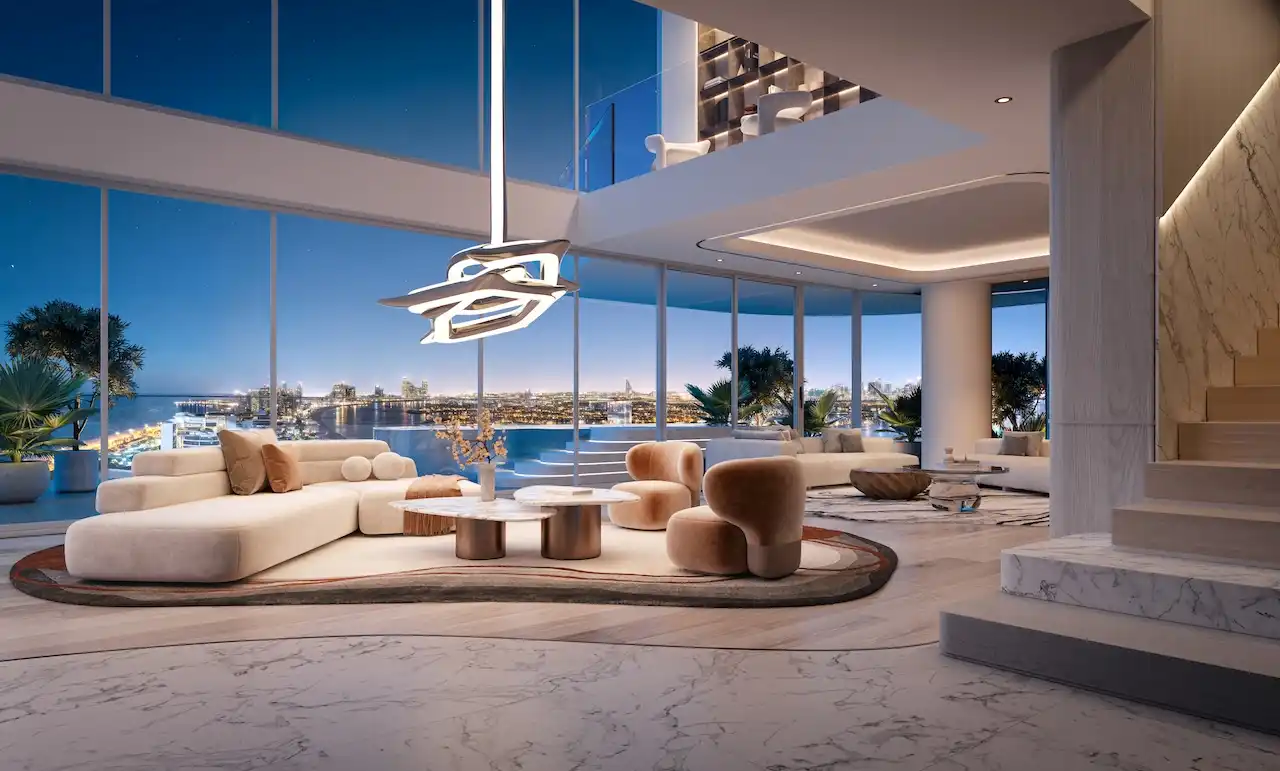 Penthouse living room at Bella at Passo by Beyond featuring double-height glazing, contemporary luxury interiors, sculptural lighting, open-plan seating, and panoramic night views over Palm Jumeirah and Dubai skyline, Presented by Tohid Fetrat