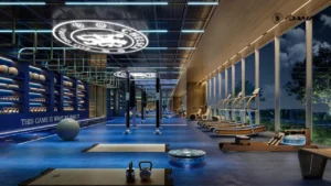 Interior view of the Chelsea Residences athlete training centre featuring a premium gym with professional fitness equipment, branded design elements, and floor to ceiling windows overlooking landscaped surroundings in Dubai, Presented by Tohid Fetrat