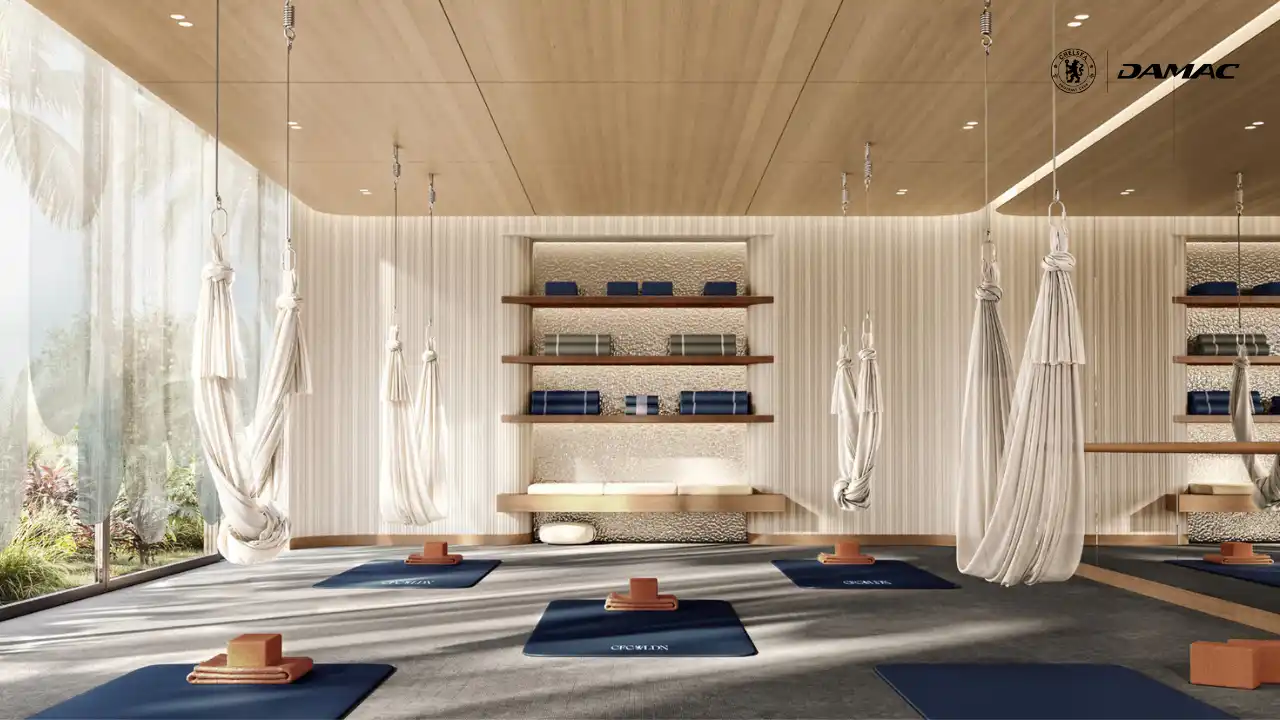 Aerial yoga and wellness studio at Chelsea Residences by DAMAC, featuring suspended yoga hammocks, calm interiors, and natural light designed to promote balance, flexibility, and a pure lifestyle in Dubai. Presented by Tohid Fetrat.