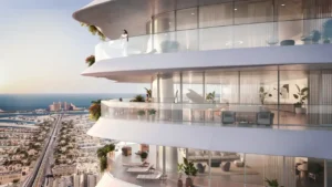 Curved balcony exterior at COMO Residences featuring private terraces, transparent glass balustrades, floor to ceiling glazing, refined interior furnishings, and panoramic sea views overlooking Palm Jumeirah in Dubai. Presented by Tohid Fetrat.