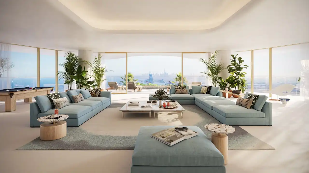 Luxury apartment interior at Como Residences by Nakheel on Palm Jumeirah, featuring an open plan living area with floor to ceiling glass windows, soft neutral furnishings, sculptural lighting, and panoramic sea views reflecting refined waterfront living. Presented by Tohid Fetrat.