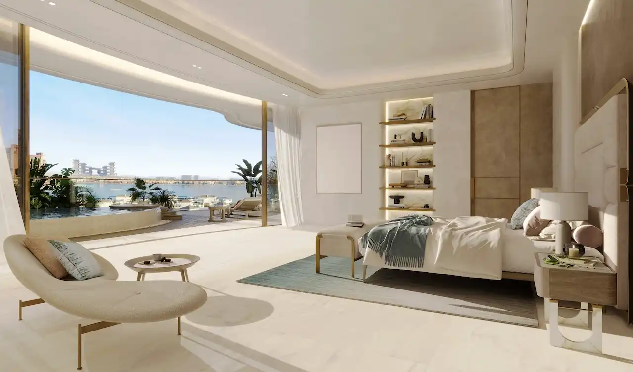 Luxury bedroom interior at COMO Residences on Palm Jumeirah featuring floor-to-ceiling glass, soft neutral tones, refined furnishings, and direct access to a private terrace with panoramic Gulf views. Presented by Tohid Fetrat.