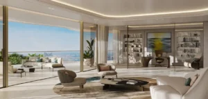 Luxury home office and living space at COMO Residences on Palm Jumeirah, featuring a refined workspace, floor-to-ceiling glass, elegant interiors, and panoramic Gulf views. Presented by Tohid Fetrat.