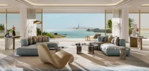 Luxury lounge at COMO Residences on Palm Jumeirah featuring an elegant open-plan layout, designer seating, floor-to-ceiling windows, and panoramic Gulf views towards Burj Al Arab. Presented by Tohid Fetrat.