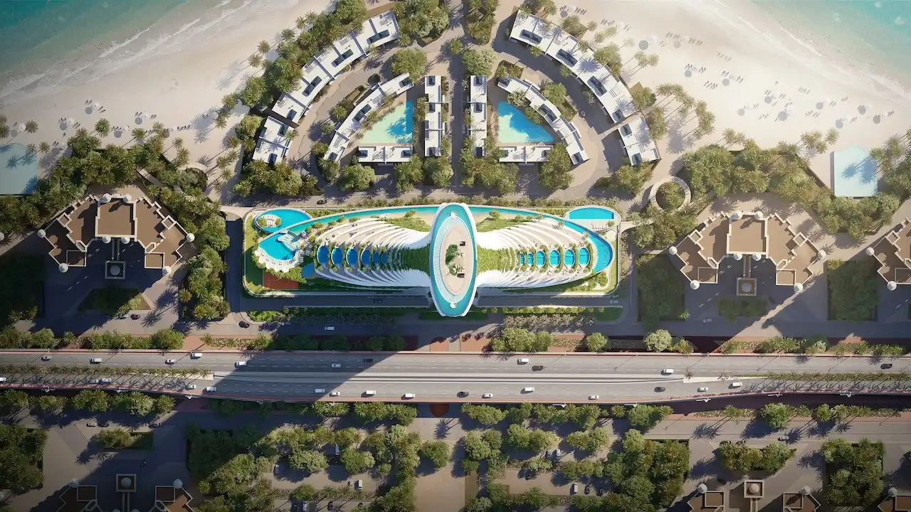 Top view masterplan of COMO Residences on Palm Jumeirah, showcasing the sculptural podium design, elevated amenities, pools, landscaped villas, beachfront setting, and direct access to the Gulf. Presented by Tohid Fetrat.