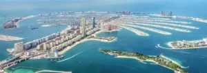 Aerial panoramic view of Palm Jumeirah showcasing the full island layout, central trunk skyline, surrounding fronds, turquoise Gulf waters, and the prime location of COMO Residences within Dubai’s iconic waterfront destination. Presented by Tohid Fetrat.
