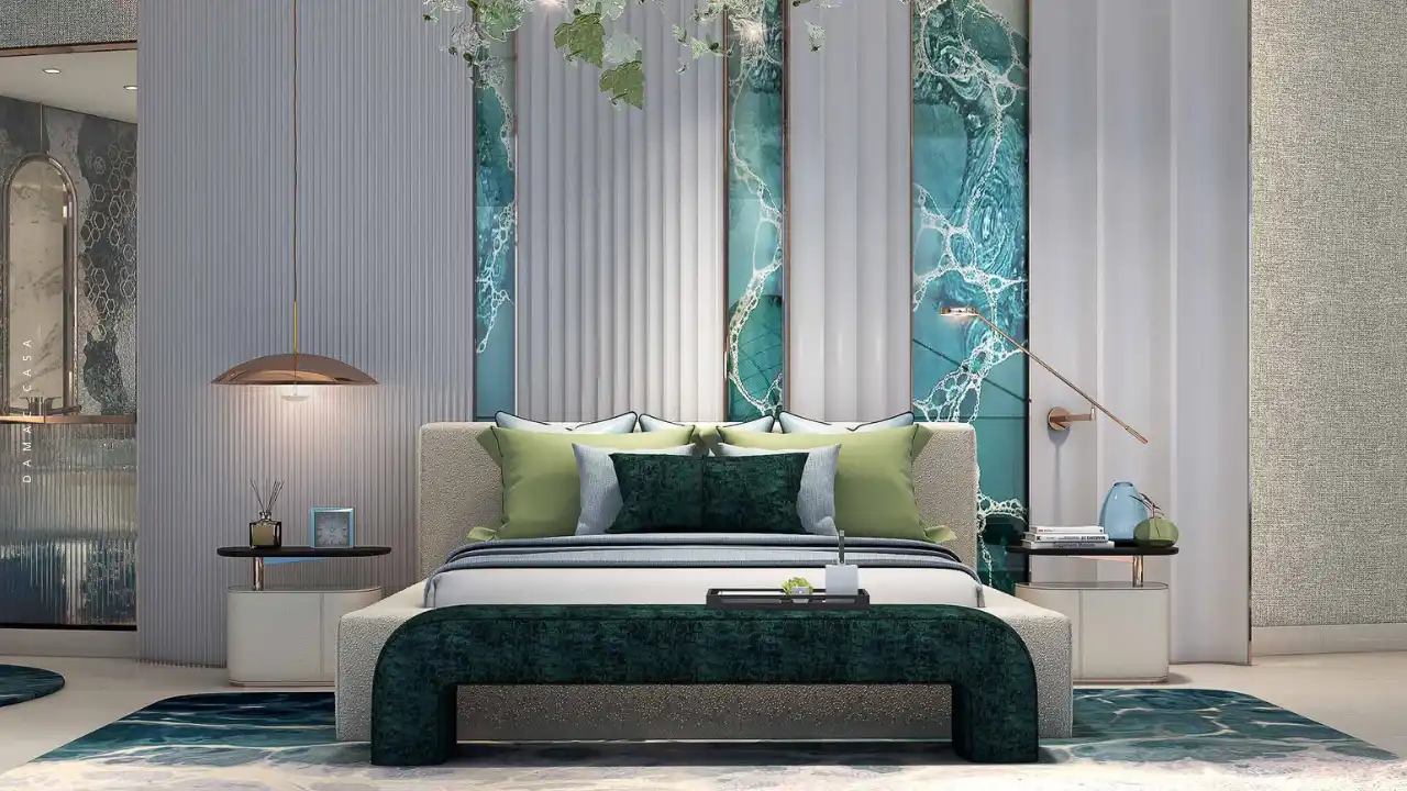 DAMAC Casa luxury master bedroom featuring elegant interior design, custom upholstered bed, marble-accent wall panels, soft lighting, and a refined modern lifestyle atmosphere in Dubai. Presented by Tohid Fetrat.