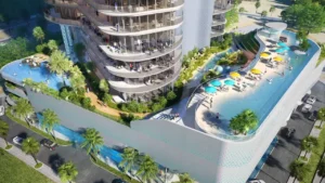 DAMAC Casa podium-level pool deck featuring resort-style swimming pools, landscaped terraces, sun loungers, and outdoor leisure spaces integrated into the building architecture in Dubai. Presented by Tohid Fetrat.