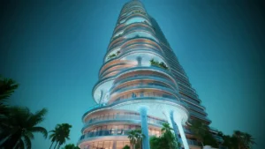 Low-angle night view of the DAMAC Casa tower, showcasing its sculptural curved balconies, illuminated architectural façade, and vertical design elements within a luxury high-rise development in Dubai. Presented by Tohid Fetrat.