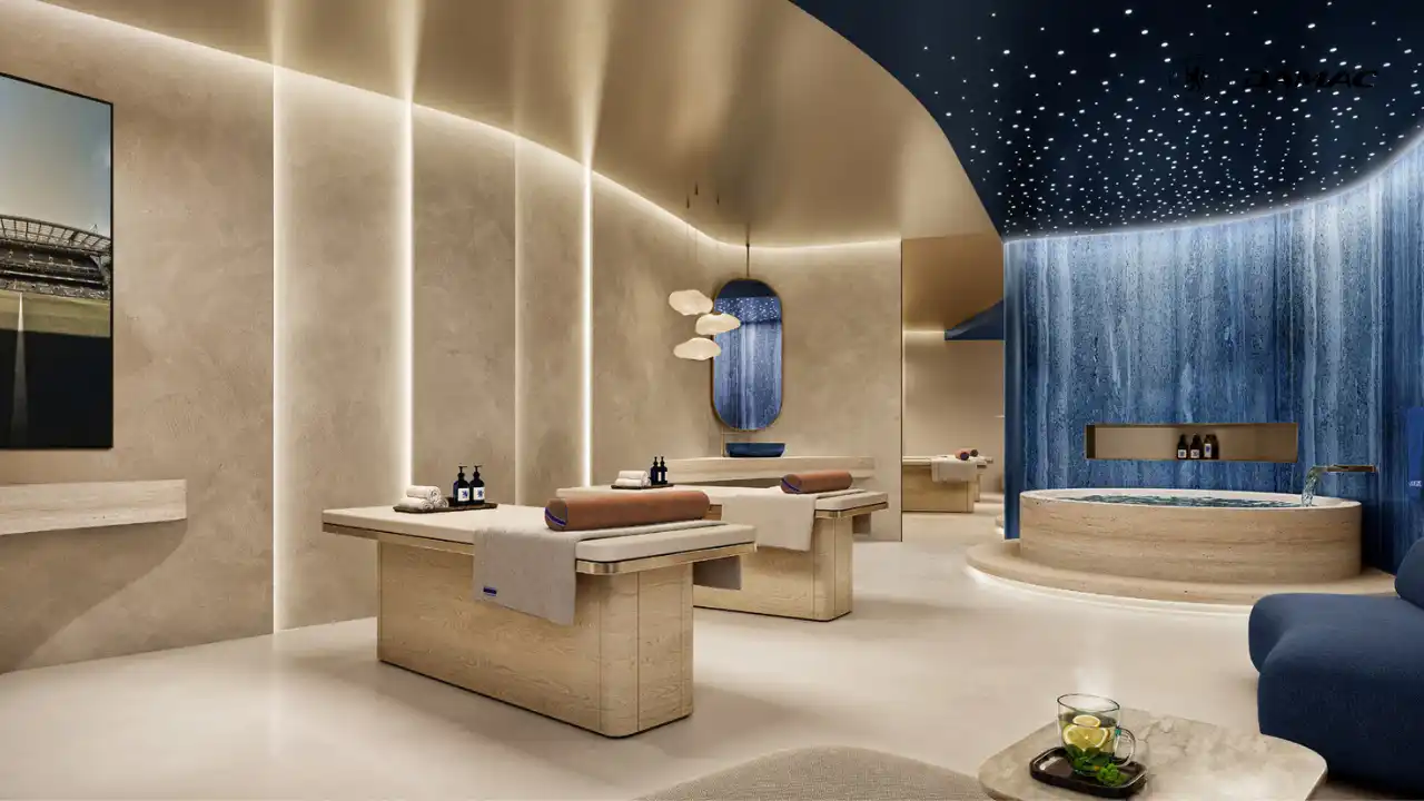 Interior view of the couples treatment room at DAMAC Chelsea Residences featuring twin massage beds, soft ambient lighting, refined materials, and a serene spa setting in Dubai, Presented by Tohid Fetrat
