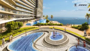 Waterfront view of the Kneipp parkour therapy area at DAMAC Chelsea Residences featuring circular water paths, textured walking zones, landscaped surroundings, and sea views in Dubai, Presented by Tohid Fetrat