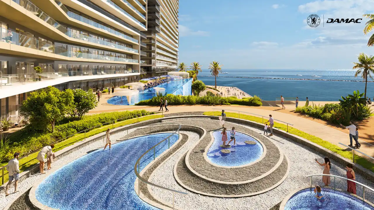 Waterfront view of the Kneipp parkour therapy area at DAMAC Chelsea Residences featuring circular water paths, textured walking zones, landscaped surroundings, and sea views in Dubai, Presented by Tohid Fetrat