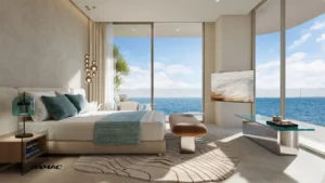 Interior view of the master bedroom at DAMAC Chelsea Residences featuring a serene bed setting, soft neutral tones, floor to ceiling windows, and uninterrupted ocean views in Dubai, Presented by Tohid Fetrat