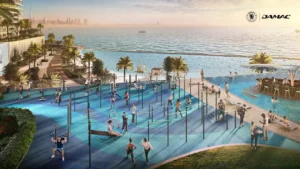 Outdoor gym at DAMAC Chelsea Residences featuring open air fitness equipment, rubberized workout surfaces, palm lined surroundings, and direct waterfront views across the Gulf in Dubai, Presented by Tohid Fetrat