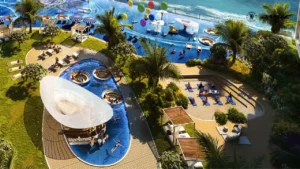 Outdoor yoga area at DAMAC Chelsea Residences featuring a dedicated wellness deck, blue pool surroundings, lush landscaping, and a calm waterfront setting in Dubai, Presented by Tohid Fetrat