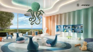 Interior view of the underwater themed kids play area at DAMAC Chelsea Residences featuring a playful octopus ceiling installation, soft sculptural seating, ocean inspired colors, and a bright child friendly recreational space in Dubai, Presented by Tohid Fetrat