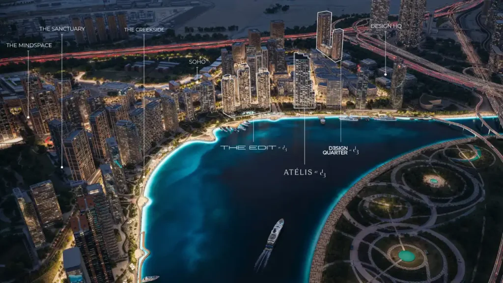 Aerial night view of Dubai Design District (d3) showing the waterfront master plan with labeled projects including The Edit at d3, Design Quarter at d3, and Atélis at d3, surrounded by modern high-rise towers and urban infrastructure. Presented by Tohid Fetrat.