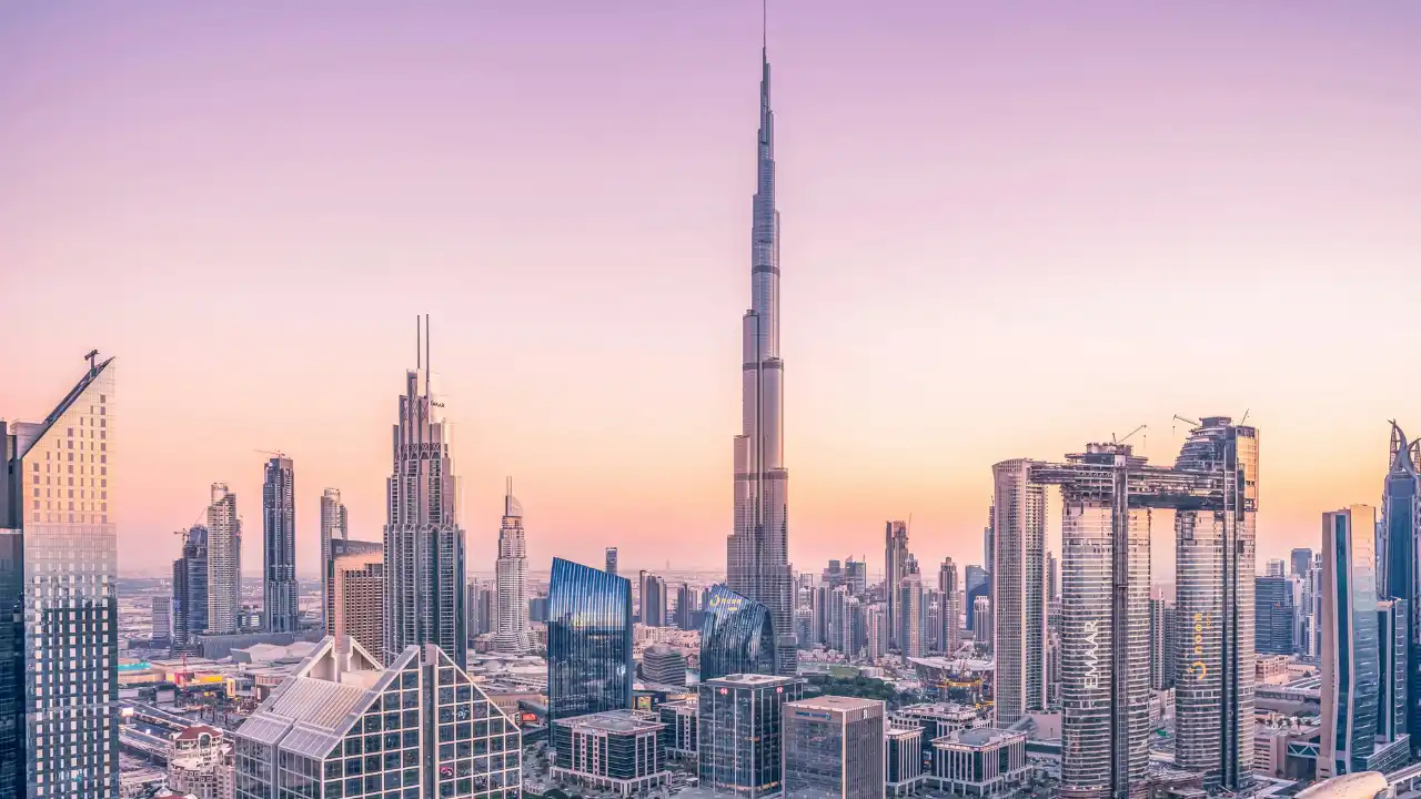 Dubai skyline at sunrise featuring Burj Khalifa and surrounding high rise towers, representing the Expression of Interest EOI process used in off plan real estate launches across Dubai. Presented by Tohid Fetrat.