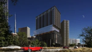 Arrival view of Haus of Tenet by IRTH in Business Bay, Dubai, highlighting contemporary architecture, landscaped surroundings, city skyline, and Burj Khalifa in the background, presented by Tohid Fetrat