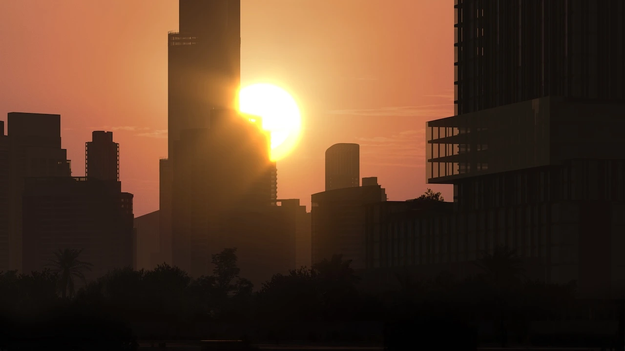 Sunset skyline view near Haus of Tenet Canal with the sun setting behind Dubai’s high-rise towers, creating a warm urban silhouette along the waterfront, presented by Tohid Fetrat
