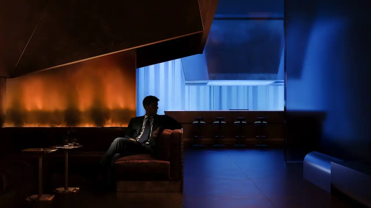 Luxury cigar lounge at Haus of Tenet by IRTH featuring moody lighting, refined leather seating, and a private executive atmosphere in Business Bay, Dubai, presented by Tohid Fetrat