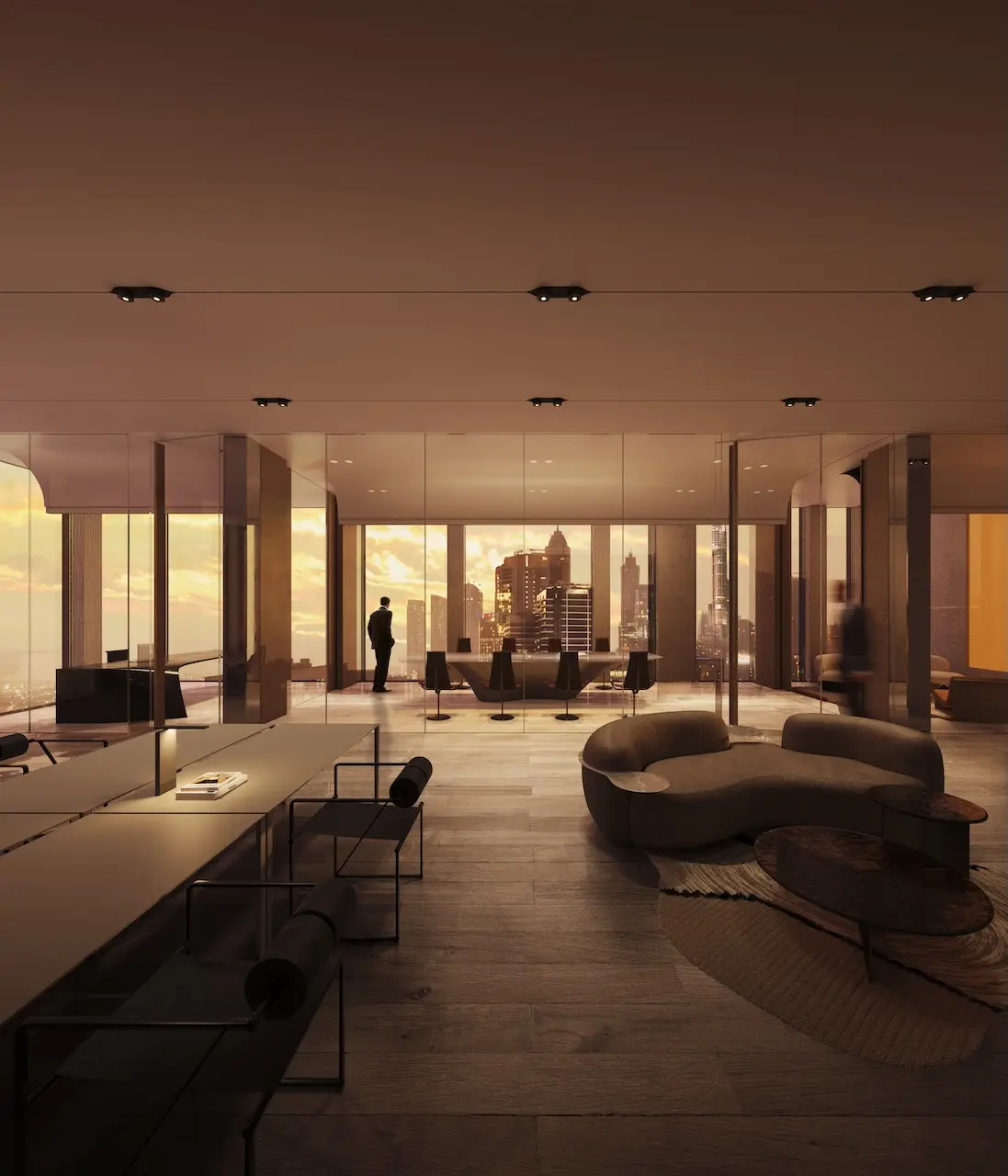 Sunset office interior at Haus of Tenet by IRTH featuring a modern open-plan workspace, warm lighting, floor-to-ceiling windows, and skyline views in Business Bay Dubai, presented by Tohid Fetrat