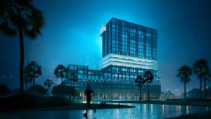 Nighttime park view of Haus of Tenet by IRTH in Business Bay, Dubai, showcasing a striking illuminated architectural form surrounded by palm-lined landscapes and reflective walkways, presented by Tohid Fetrat