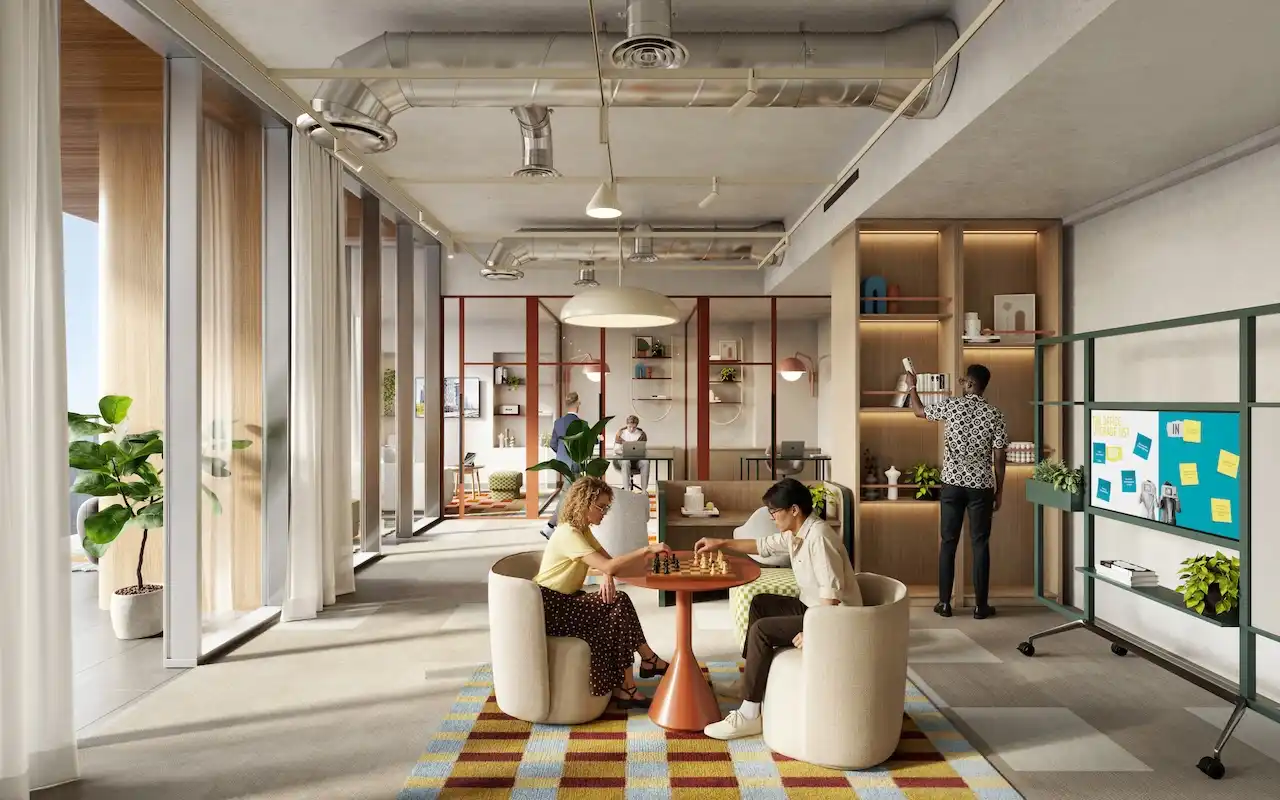 Collaborative lounge workspace at HQ by Rove featuring casual seating, shared tables, indoor plants, and warm contemporary interiors in Dubai, Presented by Tohid Fetrat