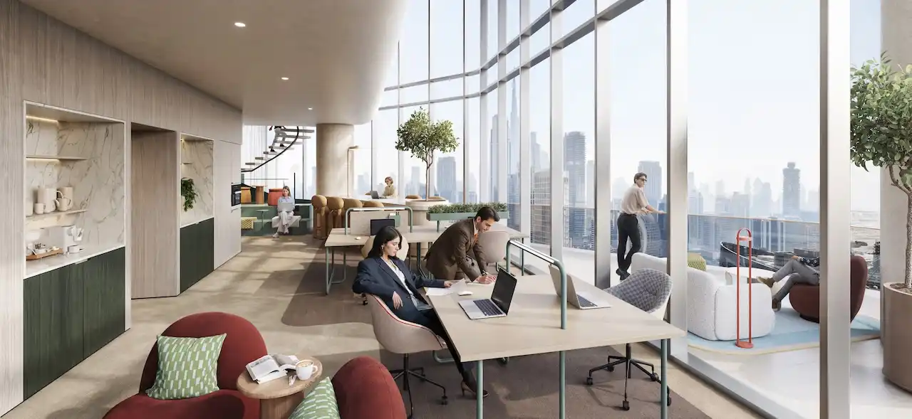 Corner loft workspace at HQ by Rove featuring floor to ceiling windows, shared workstations, lounge seating, and panoramic city skyline views in Dubai, Presented by Tohid Fetrat