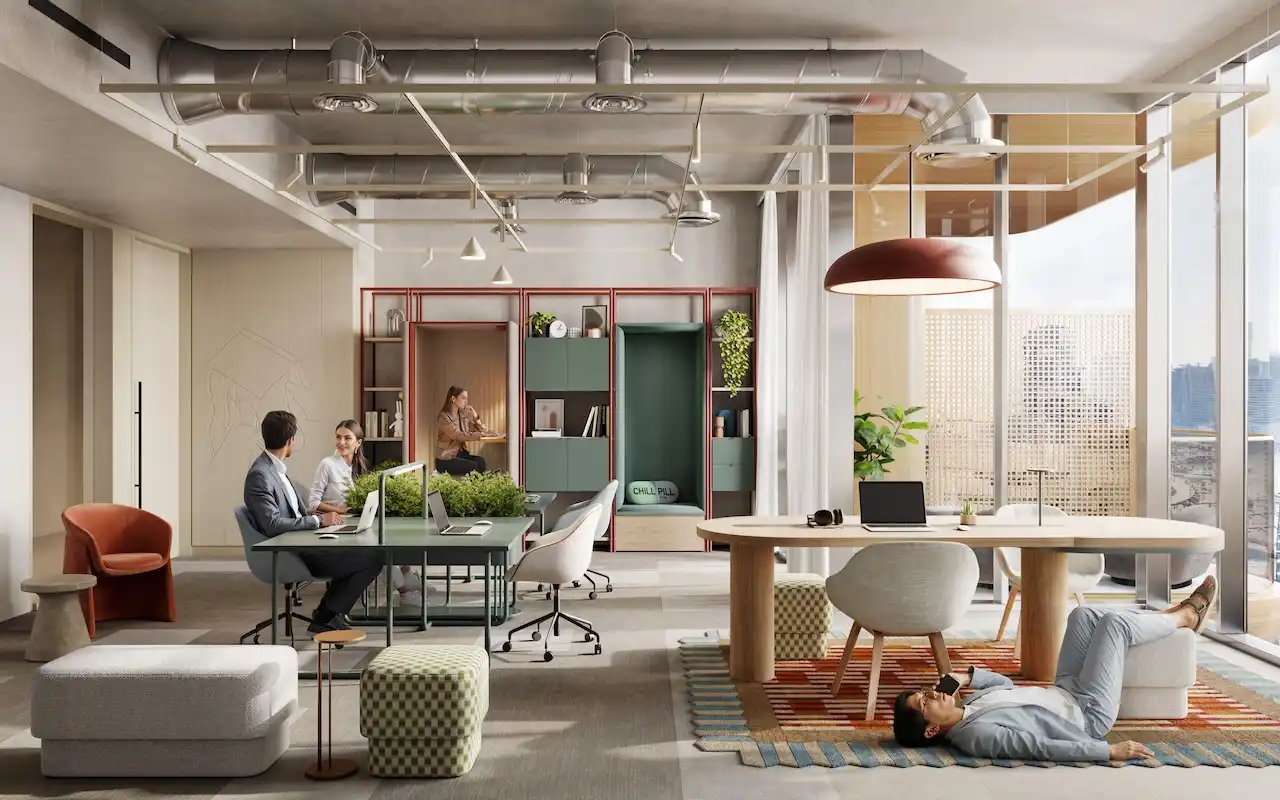 Flexible workspace interior at HQ by Rove featuring shared desks, lounge seating, indoor greenery, and large windows with natural light in Dubai, Presented by Tohid Fetrat