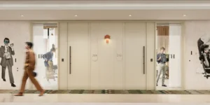 Interior corridor at HQ by Rove featuring a contemporary hallway design with soft lighting, textured walls, and artistic details in Dubai, Presented by Tohid Fetrat