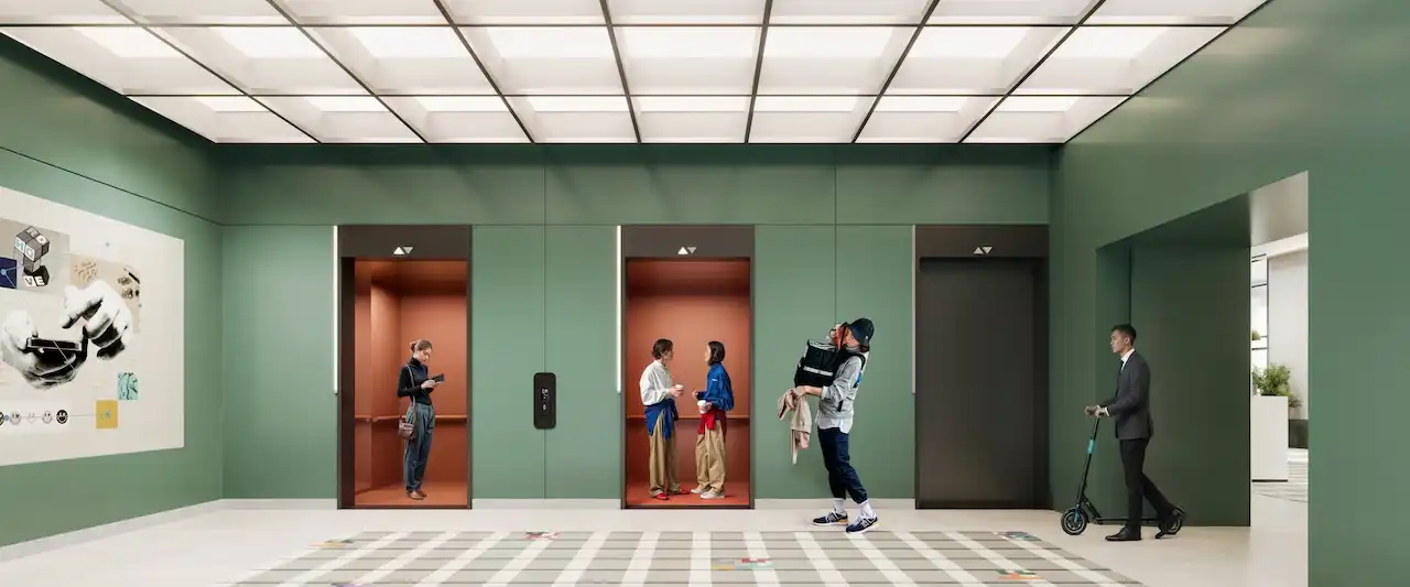 Lift lobby interior at HQ by Rove featuring contemporary elevators, soft green wall finishes, and a clean modern circulation space in Dubai, Presented by Tohid Fetrat