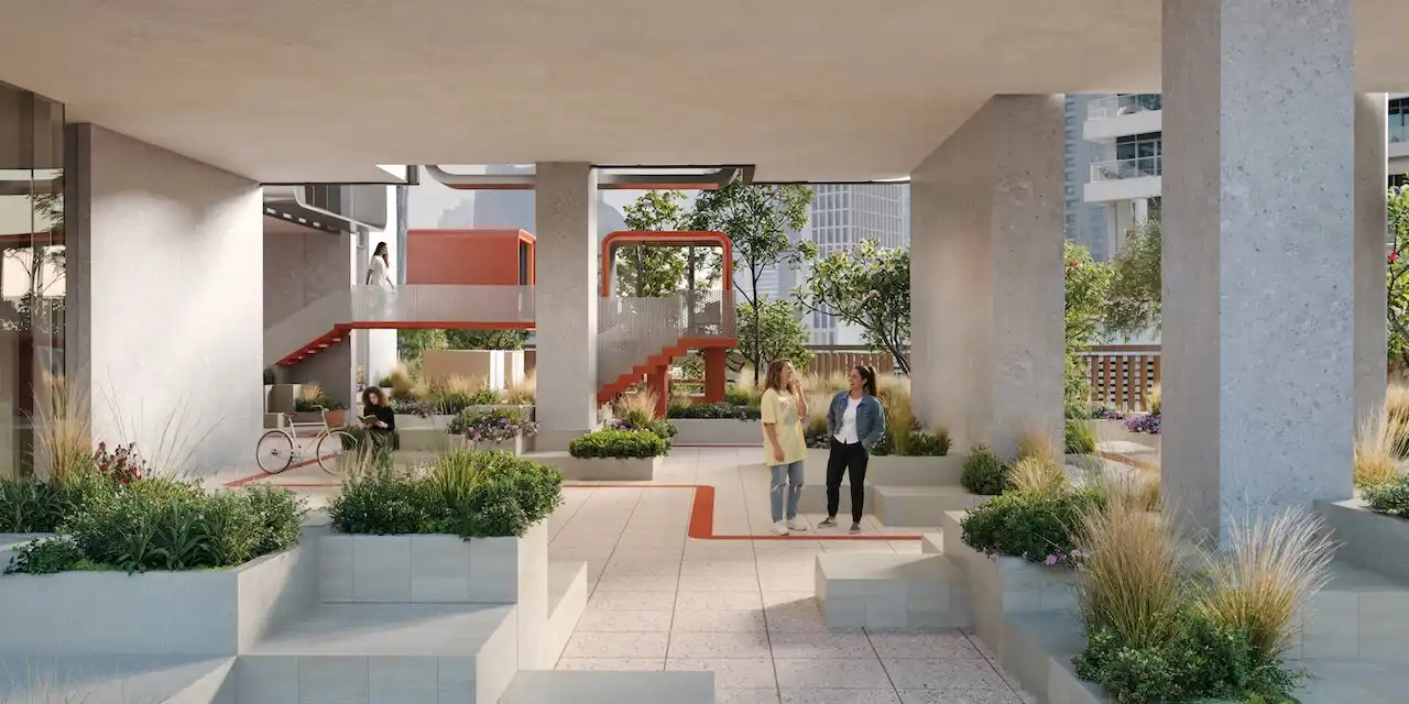 Landscaped podium courtyard at HQ by Rove featuring open air walkways, modern concrete columns, and integrated greenery in Dubai, Presented by Tohid Fetrat