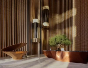 Luxury lobby interior at Lumena Alta featuring sculptural architectural elements, warm wood finishes, bespoke lighting, and refined contemporary design in Dubai. Presented by Tohid Fetrat.