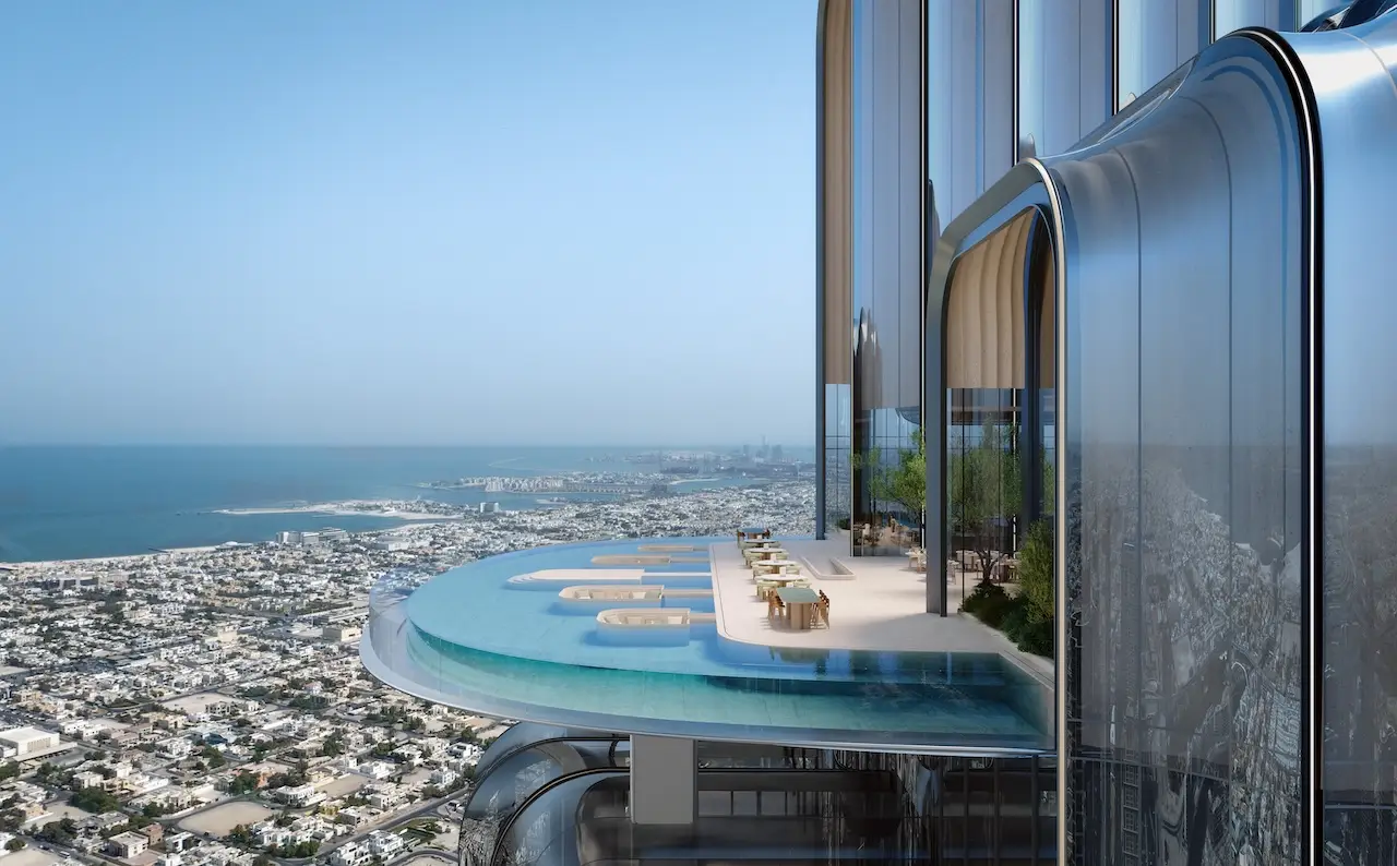 Lumena Alta elevated sky terrace and cantilevered infinity pool overlooking Dubai’s urban landscape and coastline during daytime. Presented by Tohid Fetrat.