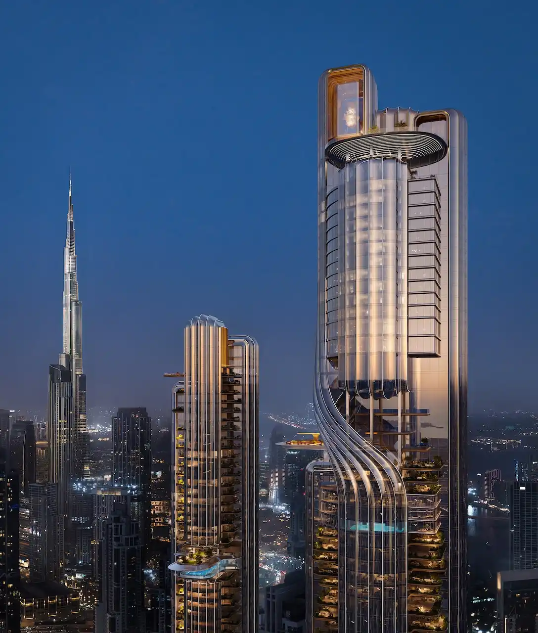 Illuminated twin towers of Lumena Alta rising above Dubai’s night skyline, with sculptural glass architecture and Burj Khalifa visible in the background. Presented by Tohid Fetrat.