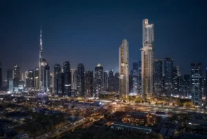 Lumena Alta twin towers illuminated at night, rising prominently within Dubai’s skyline with panoramic city views and iconic architectural lighting. Presented by Tohid Fetrat.