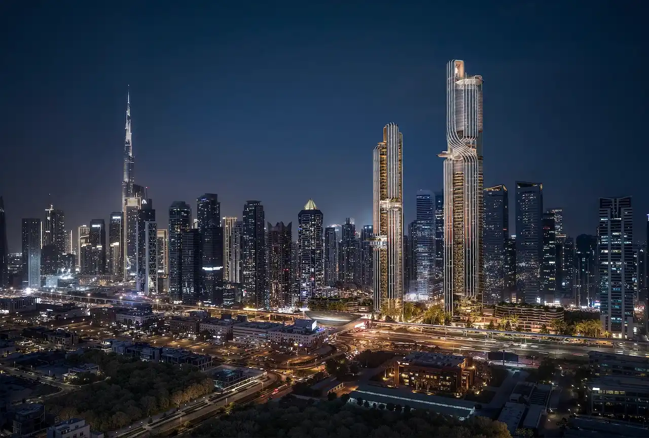 Lumena Alta twin towers illuminated at night, rising prominently within Dubai’s skyline with panoramic city views and iconic architectural lighting. Presented by Tohid Fetrat.