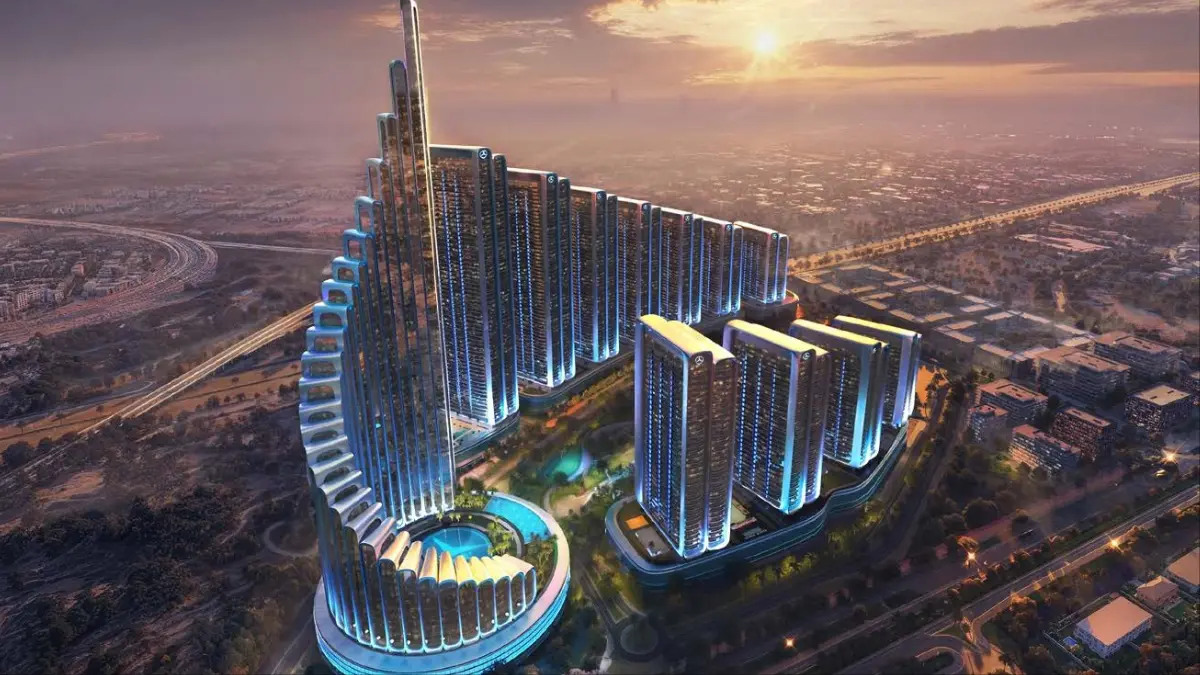 Aerial sunset view of Mercedes Benz Places-Binghatti City showcasing stepped high rise towers, illuminated façades, a landscaped central podium, and integrated urban layout within Dubai’s skyline. Presented by Tohid Fetrat.